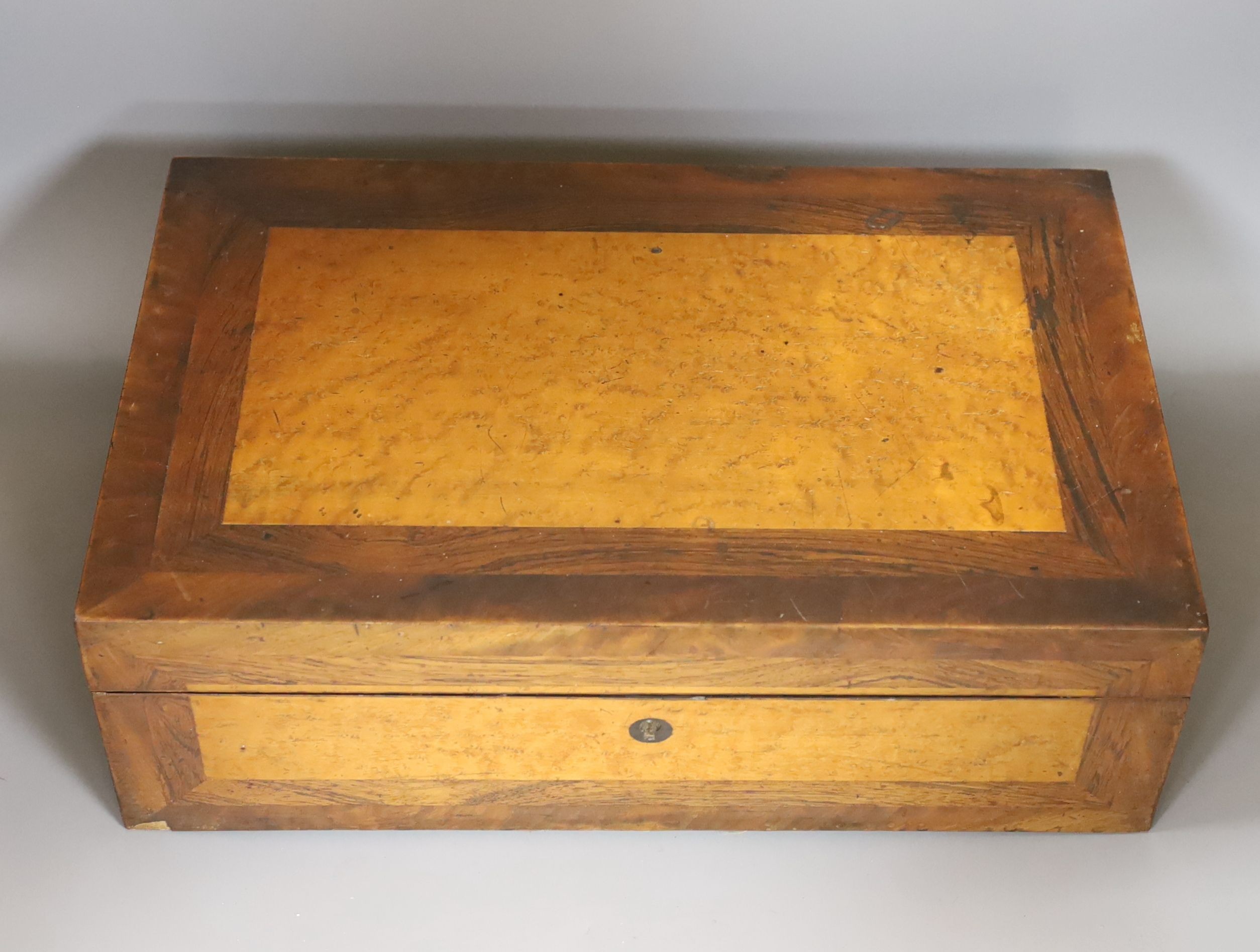 A Victorian birds eye maple and rosewood writing slope, 44.5 cms wide x 14 cms high.